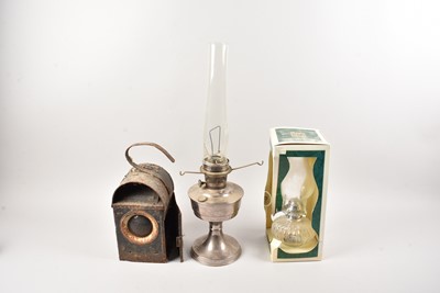 Lot 277 - A modern glass oil lamp and two other lamps