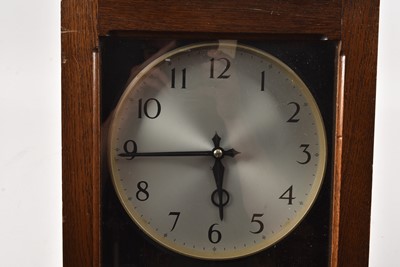 Lot 286 - A large Gent oak cased Electric wall clock