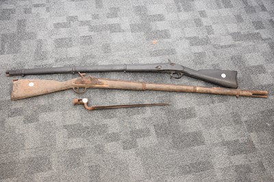 Lot 377 - Two antique and heavily worn musket rifles and a Victorian bayonet