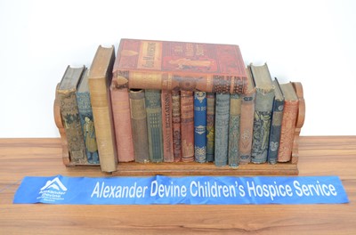 Lot 382 - A Victorian oak book trough and 18 books