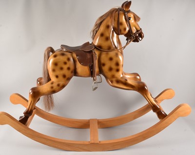 Lot 444 - A fine modern rocking horse with leatherette saddle and horsehair mane and tail 121cm height, 158 wide.