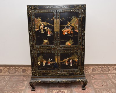 Lot 449 - A late 19th century or early 20th century Japanese black lacquer and inlaid cabinet on stand