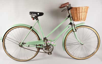 Lot 450 - A retro Phillips lady's bicycle with wicker basket and later painted but having original bar brakes to front brakes