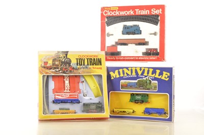 Lot 87 - Tri-ang 00 Gauge Wholesale Market clockwork Starter Sets and Tri-ang Hornby Starter Set (3 sets)