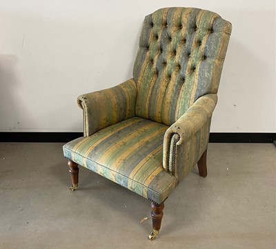 Lot 375 - A vintage upholstered armchair