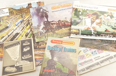 Lot 600 - Tri-ang Tri-ang Hornby and Hornby  00 Gauge Catalogues including Amalgamation Leafet Track Plans Minic Motorway  T/H Book of Trains and other items (26)