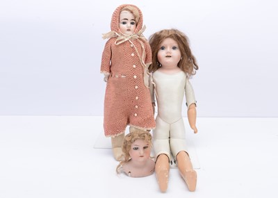 Lot 249 - Three bisque shoulder-head dolls