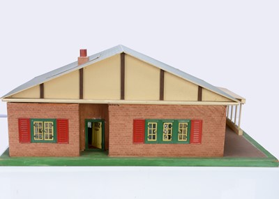 Lot 354 - A home-made wooden bungalow dolls' house, 1960s