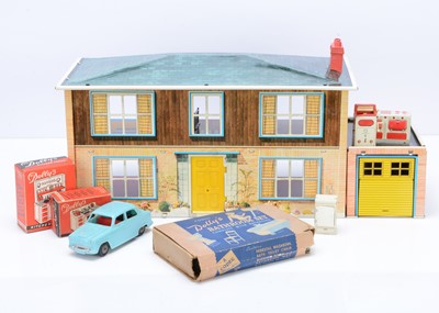 Lot 356 - A Mettoy lithographed tinplate Dolls' House with Garage