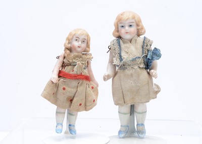 Lot 377 - Two all-bisque dolls' house girl dolls