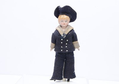 Lot 378 - A bisque shoulder-head dolls' house or small boy doll