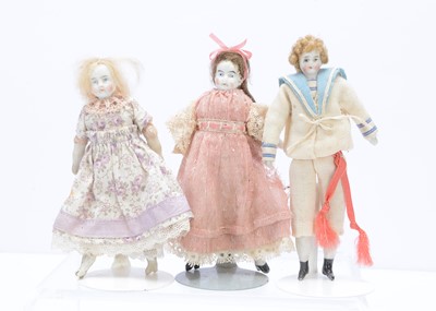 Lot 380 - Three white bisque dolls' house dolls