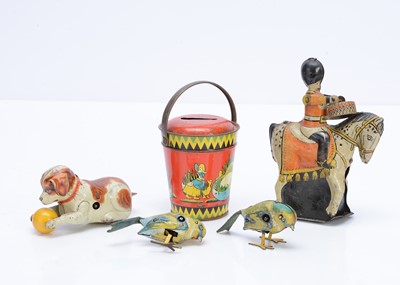 Lot 411 - Four tinplate clockwork toys