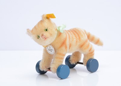 Lot 569 - A Steiff yellow tag Classic 1928 Tabby cat replica on wheels, 1995-1998