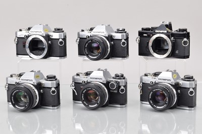 Lot 524 - Six Olympus OM SLR Cameras