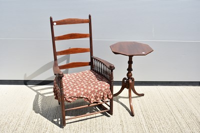 Lot 9 - A tall back rocking armchair