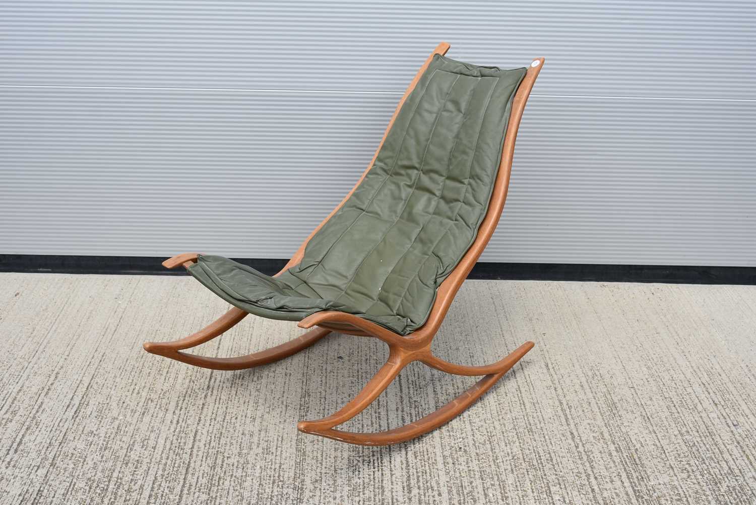 Lot 41 - An 1970s' oak and leather rocking / easy chair designed by Robin Williams