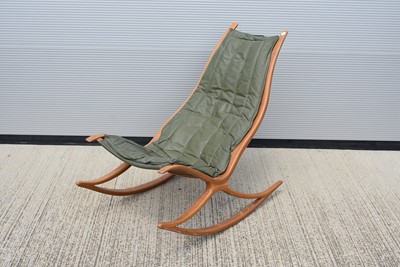 Lot 41 - An 1970s' oak and leather rocking / easy chair designed by Robin Williams