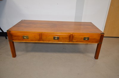 Lot 60 - A 20th Century ‘Campaign Furniture’ style teak coffee table