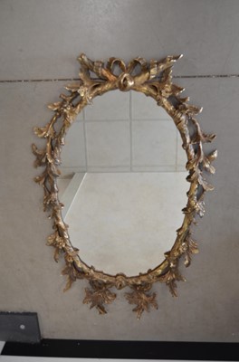 Lot 66 - A reproduction George II style ‘Horndale’ pattern oval wall mirror