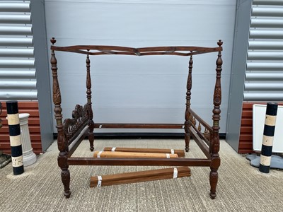 Lot 71 - A Rajasthani hardwood four poster bed frame