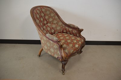 Lot 92 - A Victorian carved walnut framed low armchair