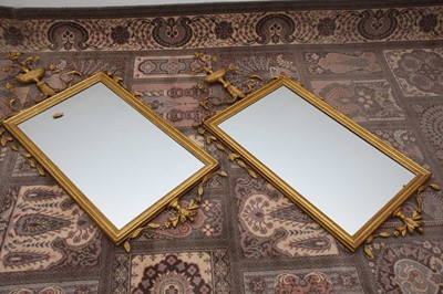 Lot 103 - A pair of Regency style gilt gesso pier glass mirrors