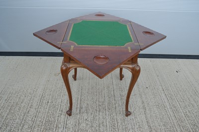 Lot 131 - A late 19th to Early 20th Century French walnut envelope card table