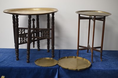 Lot 137 - Two Moresque or Indo-Persian foldable occassional tables with brass trays