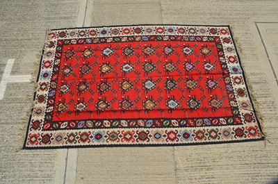 Lot 153 - A large Middle Eastern 'kilim' style wool rug