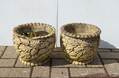 Lot 171 - A pair of reconstituted stone planters with moulded oak-leaf decorations