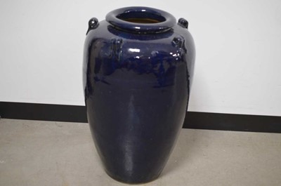 Lot 179 - A large aubergine glazed 'Ali-Baba' or 'Snake Charmer' shape jar