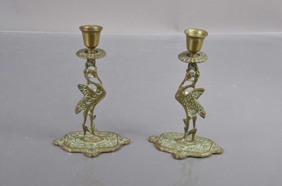 Lot 180 - A pair of early 20th Century brass 'Liverbird' candlesticks