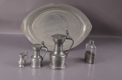 Lot 307 - Three graduated lidded jugs in pewter with acorn thumpieces