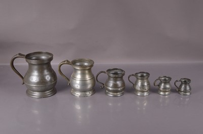 Lot 323 - A graduated set of six 19th Century pewter measures