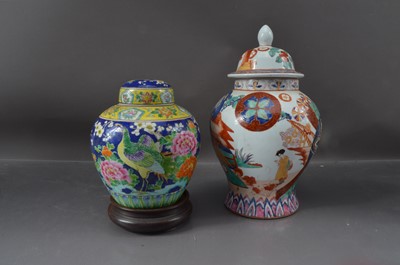 Lot 331 - A Japanese porcelain ginger jar and cover with a hardwood stand