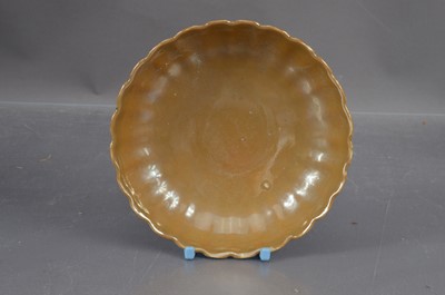 Lot 350 - A Chinese Qing Dynasty café-au-lait monochrome glaze saucer dish