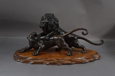 Lot 360 - A Meiji Period Japanese bronze sculpture group by Akasofu Gyōkō of a lion and tiger fighting