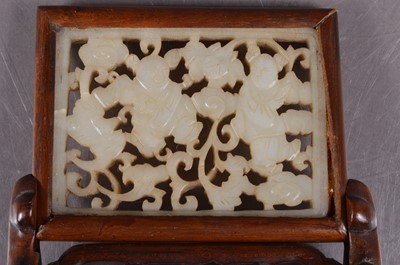 Lot 379 - A Chinese reticulated jade plaque mounted as a miniature table screen