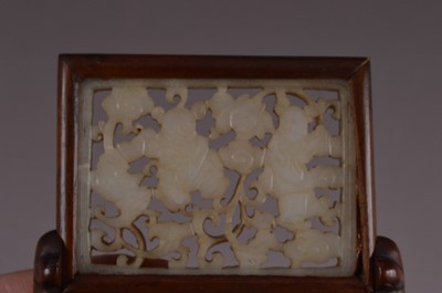 Lot 379 - A Chinese reticulated jade plaque mounted as a miniature table screen