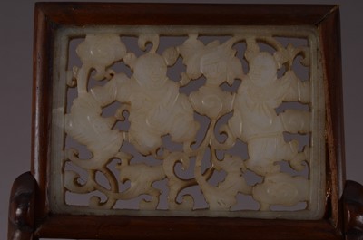 Lot 379 - A Chinese reticulated jade plaque mounted as a miniature table screen