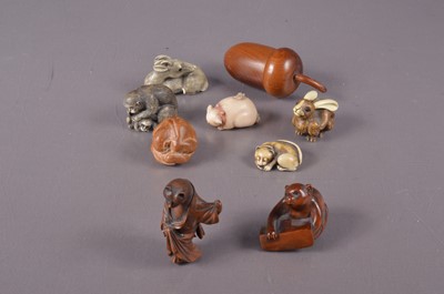 Lot 380 - A signed hand-carved boxwood netsuke of a bat on a ledge