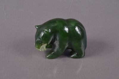 Lot 381 - A small Canadian Inuit nephrite carving of a bear with a fish