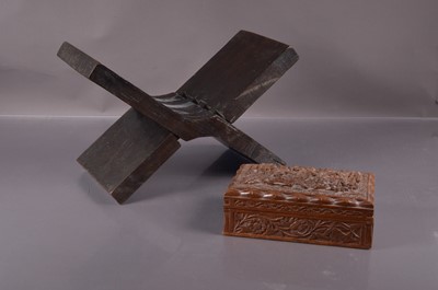 Lot 382 - A carved hardwood Koran stand with arabesque decoration