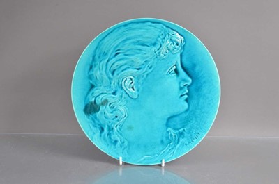 Lot 394 - A Burmantofts art pottery turquoise glazed relief portrait profile wall plaque