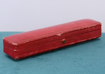 Lot 47 - A Cartier red leather and gilt tooled box