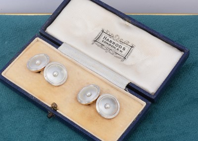 Lot 50 - A pair of gold mother of pearl and seed pearl cufflinks