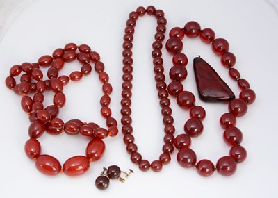 Lot 60 - Three 'Chery Amber' resin beaded necklaces