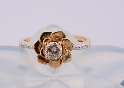 Lot 88 - A continental 18ct gold and diamond set flower dress ring