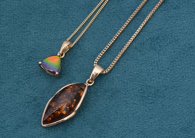 Lot 94 - Two organic gem pendants